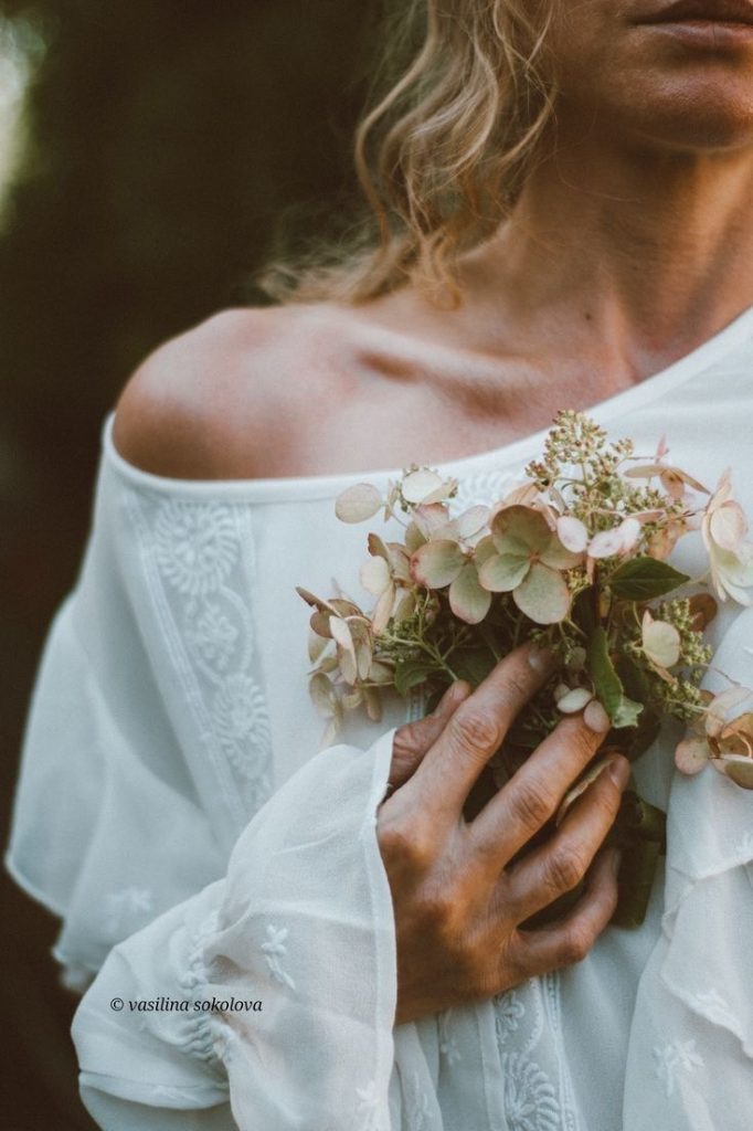 Woman holding bouquet of flowers